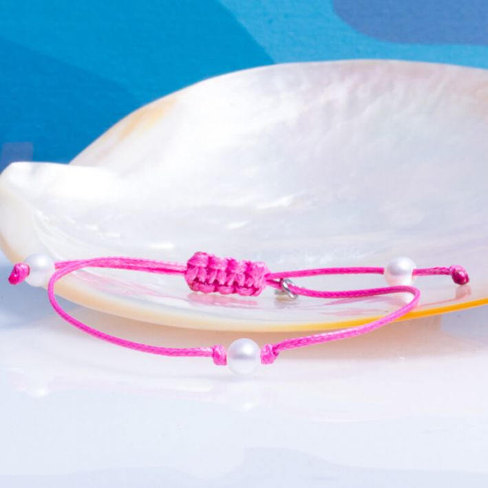 Bracelet coulissant en coton ciré rose et sa perle de culture blanche