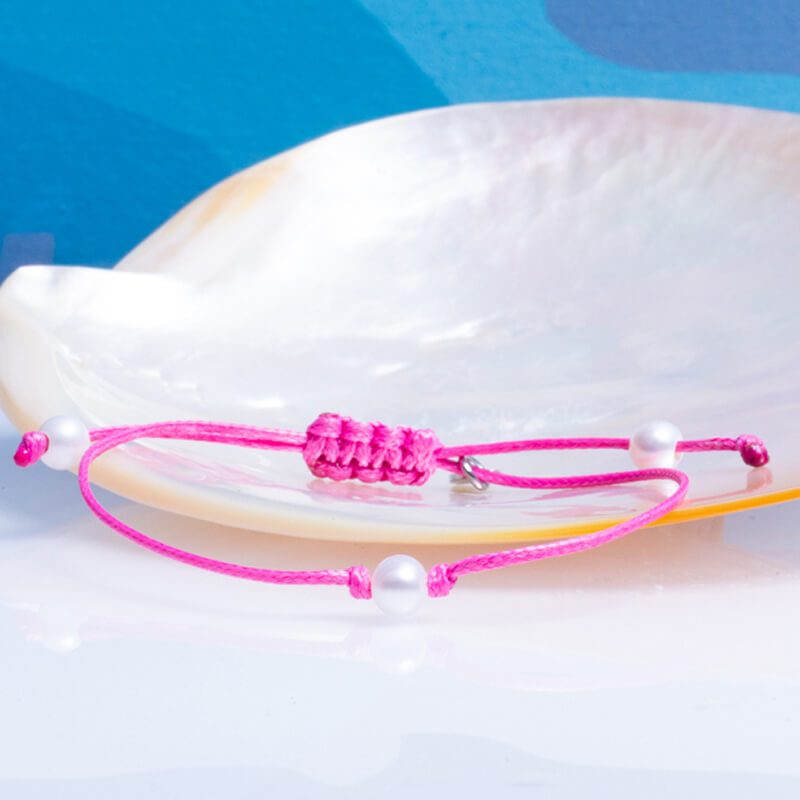 Bracelet coulissant en coton ciré rose et sa perle de culture blanche