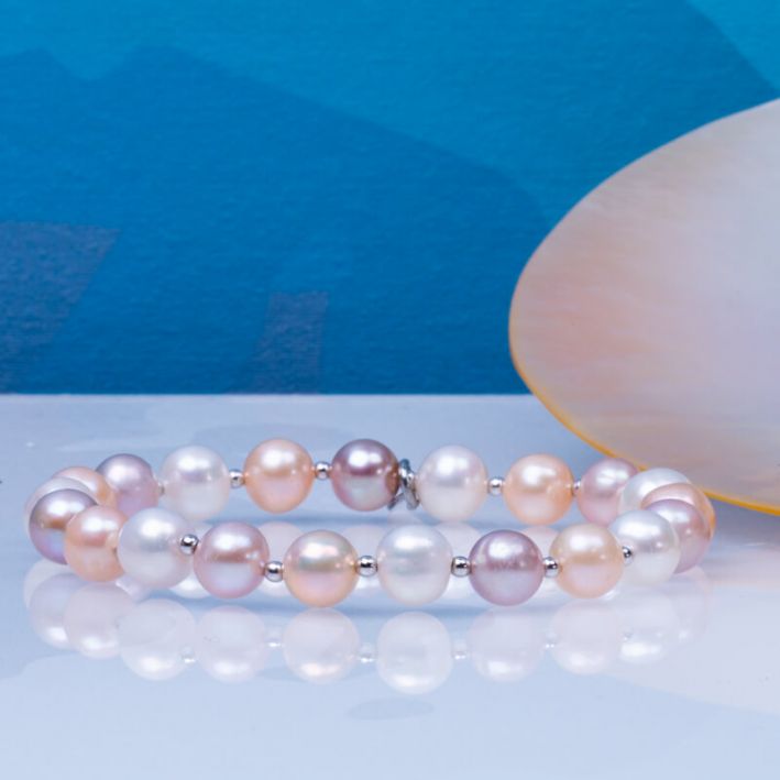 Bracelet perles de culture blanches, roses, pêches et perles en argent massif