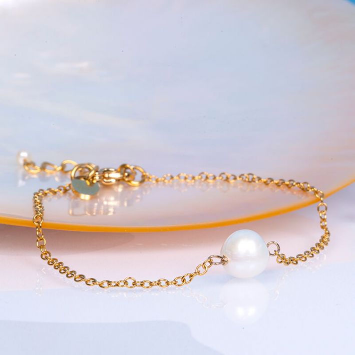 Bracelet GAIA une perle de culture ronde et blanche sur chaîne dorée