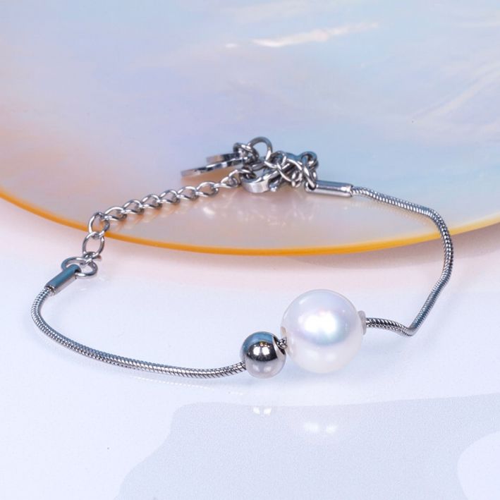 Bracelet ARTEMIS perle de culture blanche et perle en métal argenté sur acier argenté