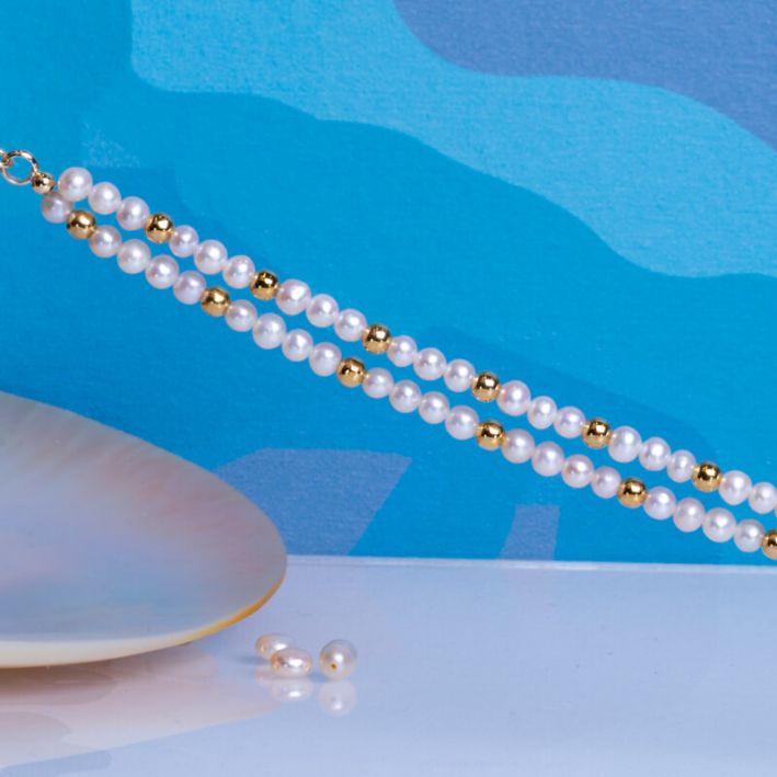 Bracelet double rangs perles de culture blanches et perles en acier doré
